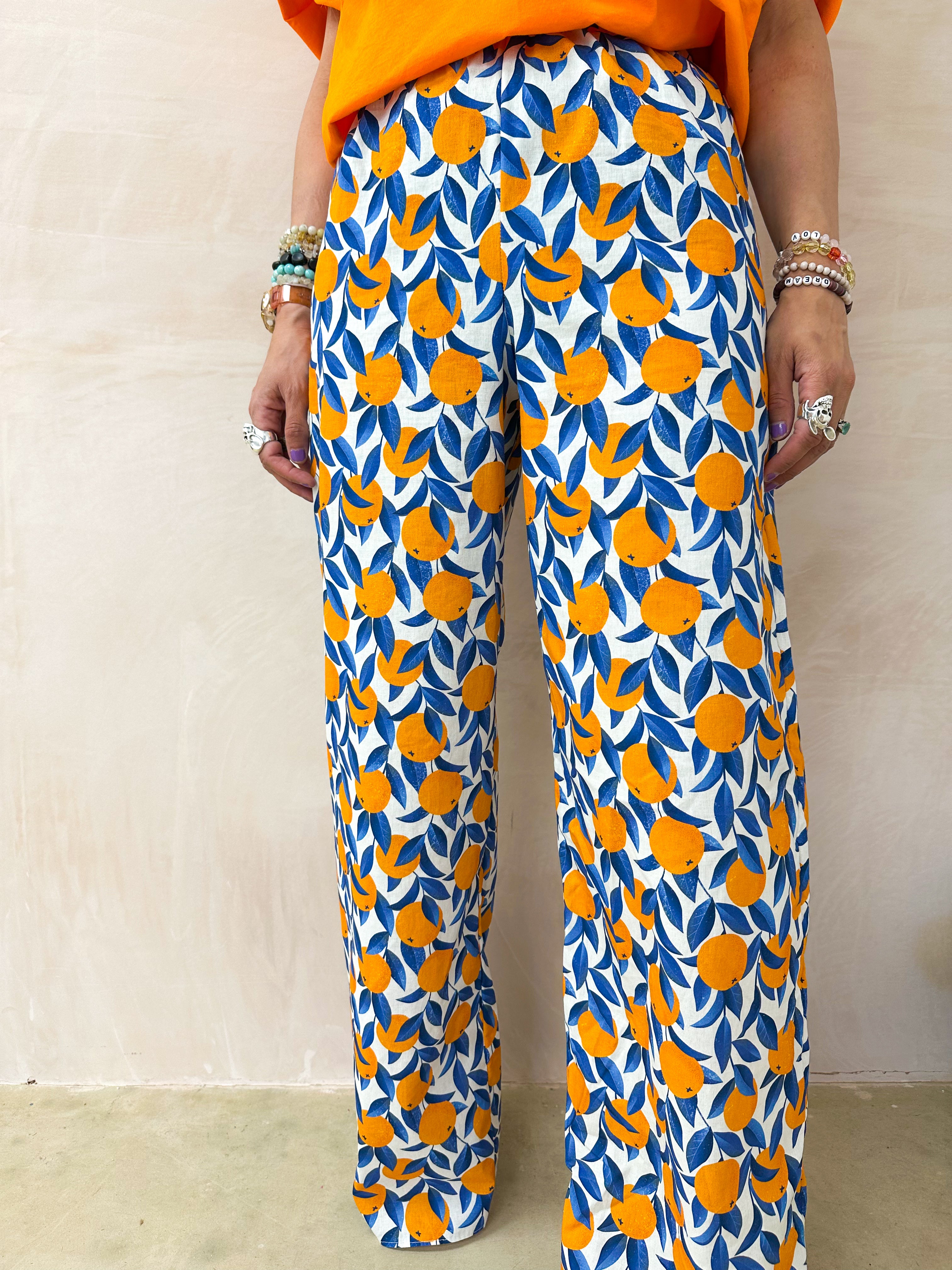 The Sicilia Wide Leg Trousers In Scattered Orange Print