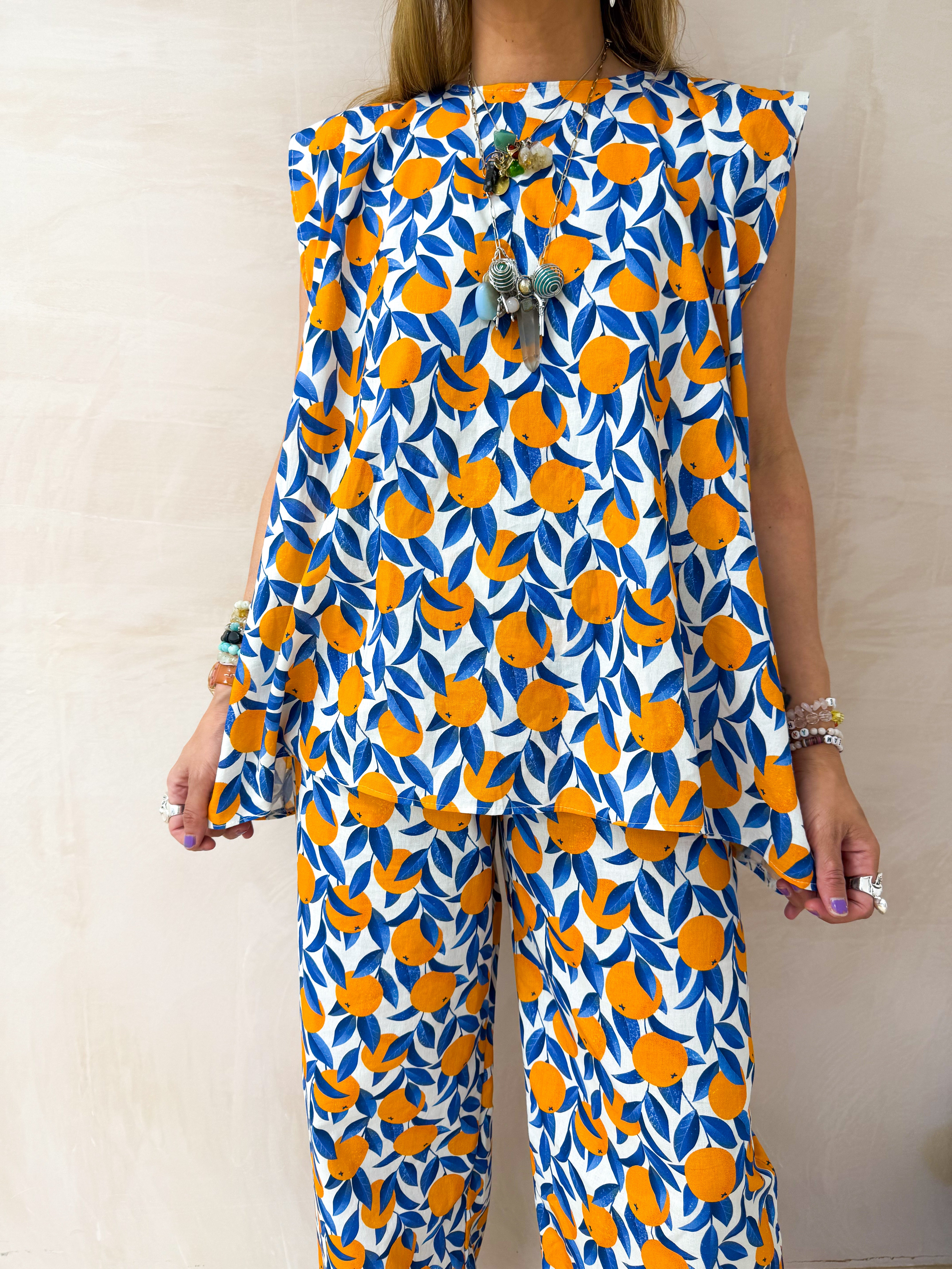 The Sicilia Belted Top In Scattered Orange Print