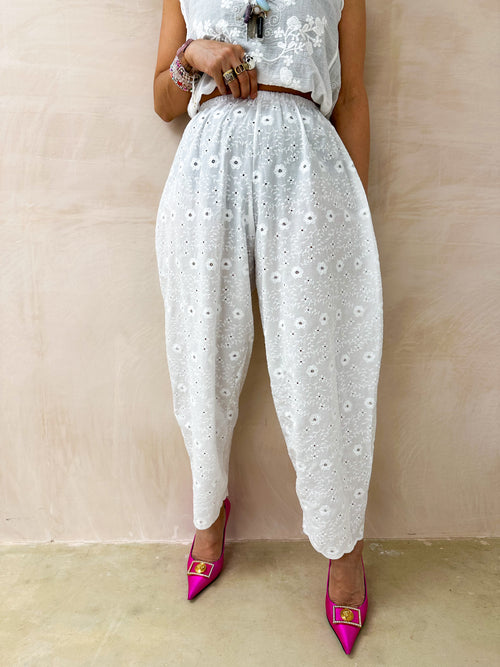 model wearing Broderie Anglaise Balloon Trousers In White style with matching top 

