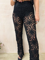 close up of model wearing High Waisted Crochet Trousers In Black