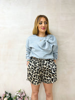 model wearing drawstring waist Floaty High Waisted Shorts In Leopard Print styled grey sweatshirt