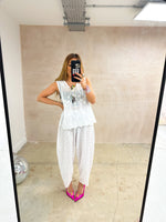 mirror selfie of model wearing Broderie Anglaise Balloon Trousers In White style with matching top 