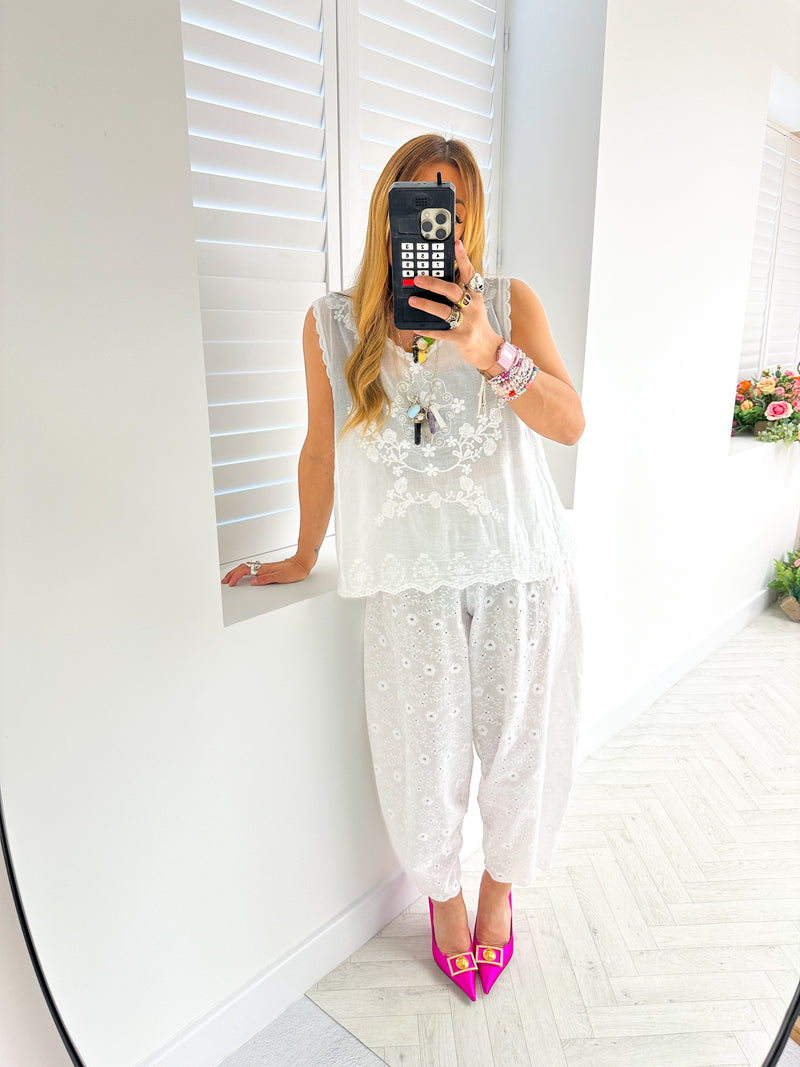 mirror selfie of model wearing Broderie Anglaise Balloon Trousers In White style with matching top 