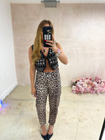 model wearing Embellished Sequin Waistcoat In Black styled with leopard print tappered jeans