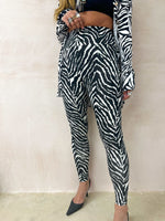 model wears High Waisted Leggings In Zebra Print